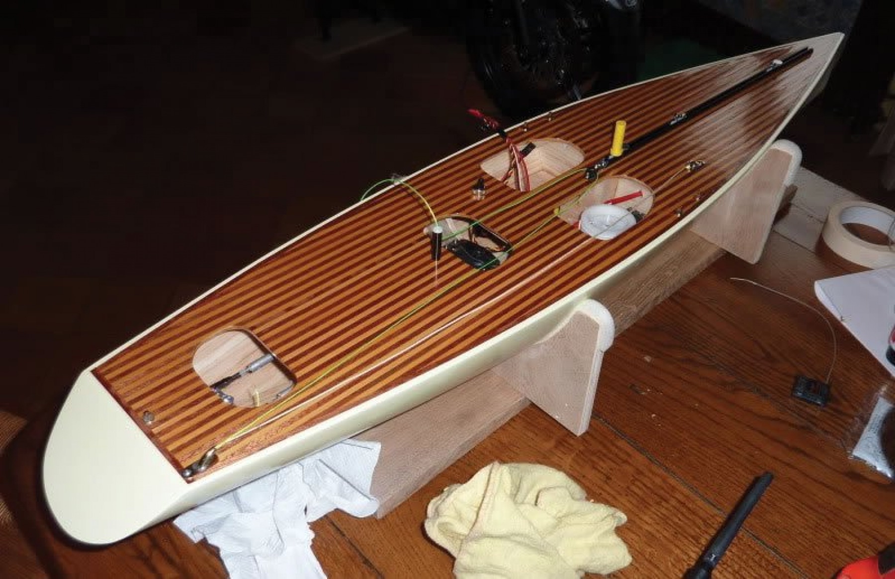 Garry Angel's Racing Sparrow one-meter model yacht, showcasing beautifully planked decks with alternating light and dark cedarwood strips. A stunning-looking model.