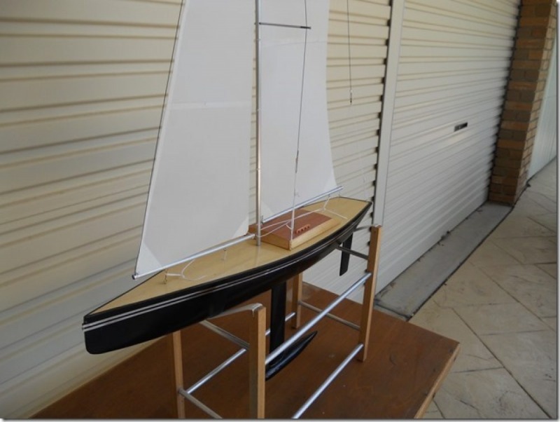 The original black pearl rc yacht with a black hull and wooden decking with wooden hatch, Location: Australia