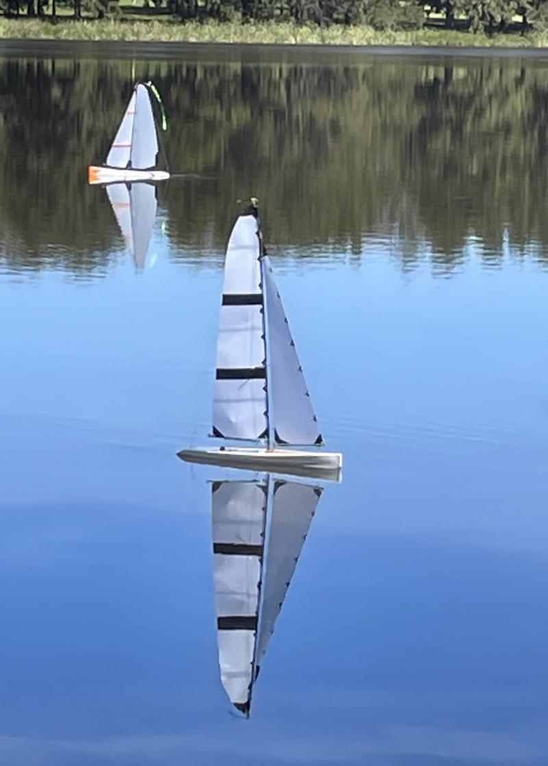 Jerry Cashmans Racing Sparrow sailing on a still lake, Location: Canberra, Australia