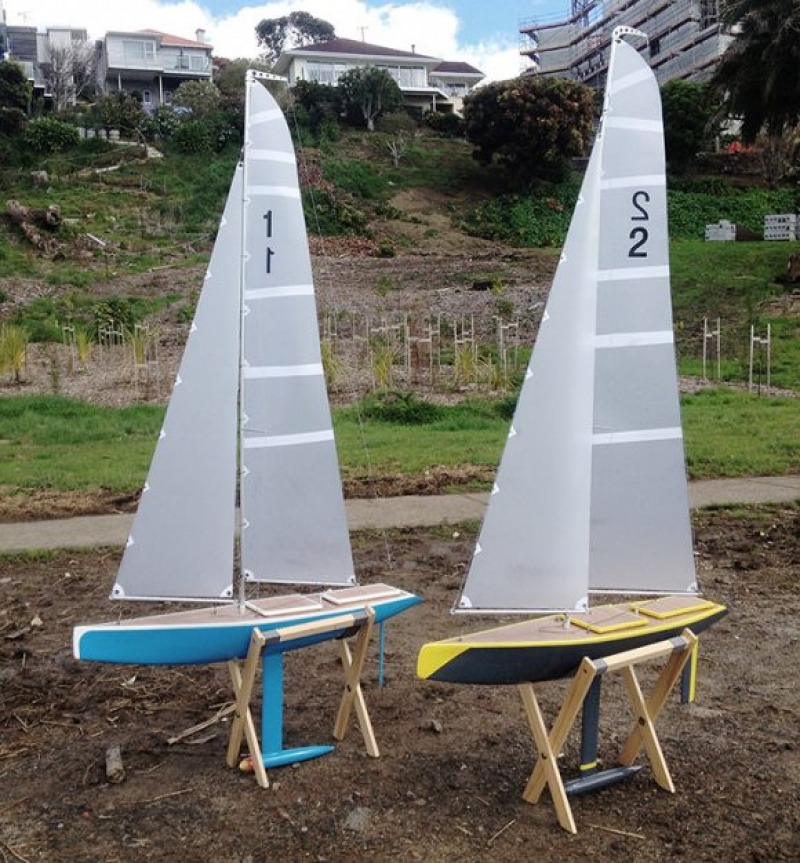 two rc model yachts, one blue, the other grey and yellow. They are both racing sparrow 750s, Location: Auckland