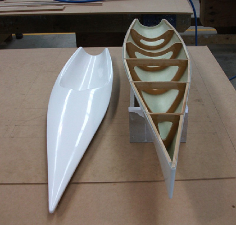 A white model yacht hull and deck molded from fibreglass, Location: Gold Coast, Australia