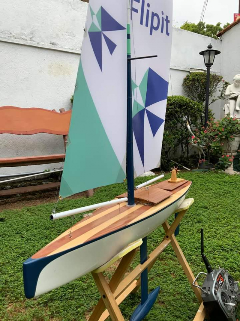 Bright coloured sails on this Racing Sparrow model yacht with a striped wooden deck, Location: Kohuwala, Sri Lanka