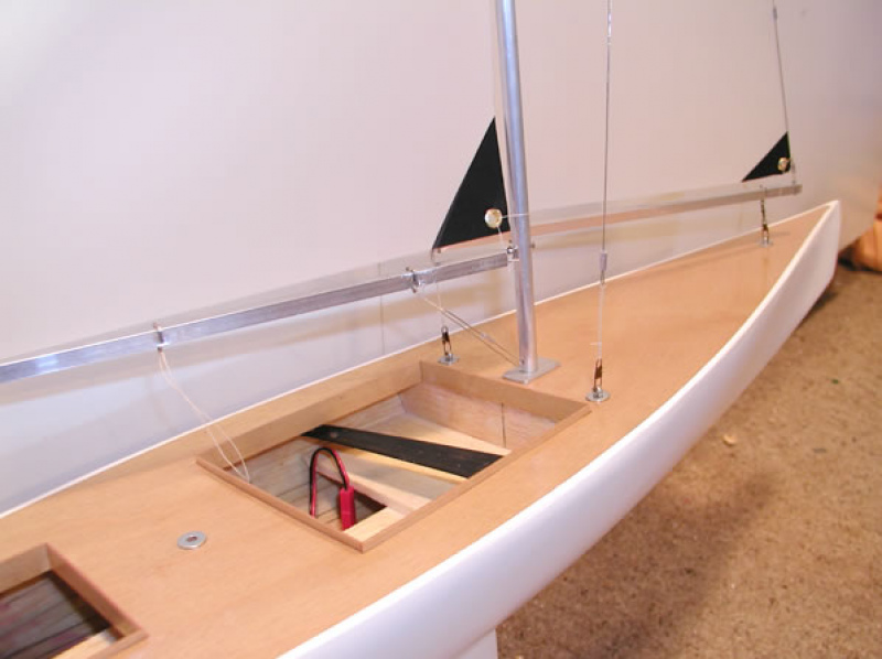 A nearly finished model yacht sitting on a work bench, Location: Auckland, New Zealand