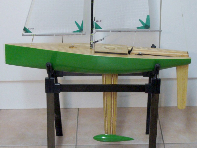 Kevins bright green RG65 Racing Sparrow designed yacht looking side on to the yacht sitting in a cradle, Location: New Zealand