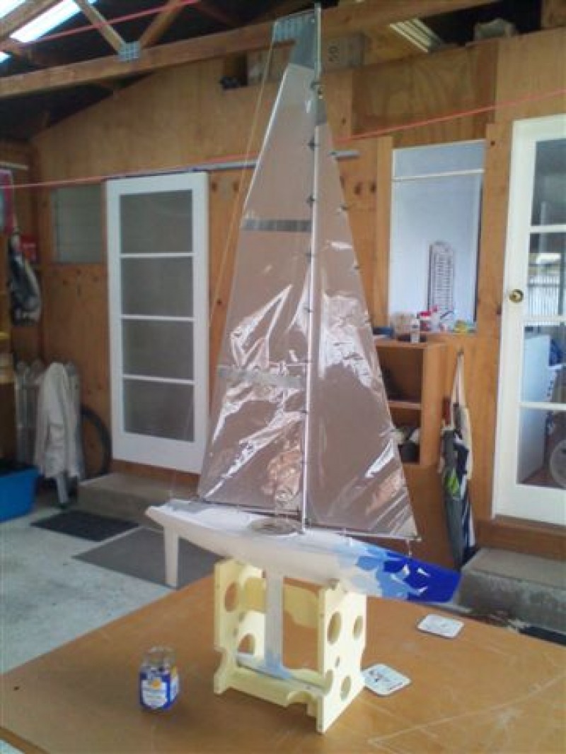 A white and blue model yacht, racing sparrow design, Location: England