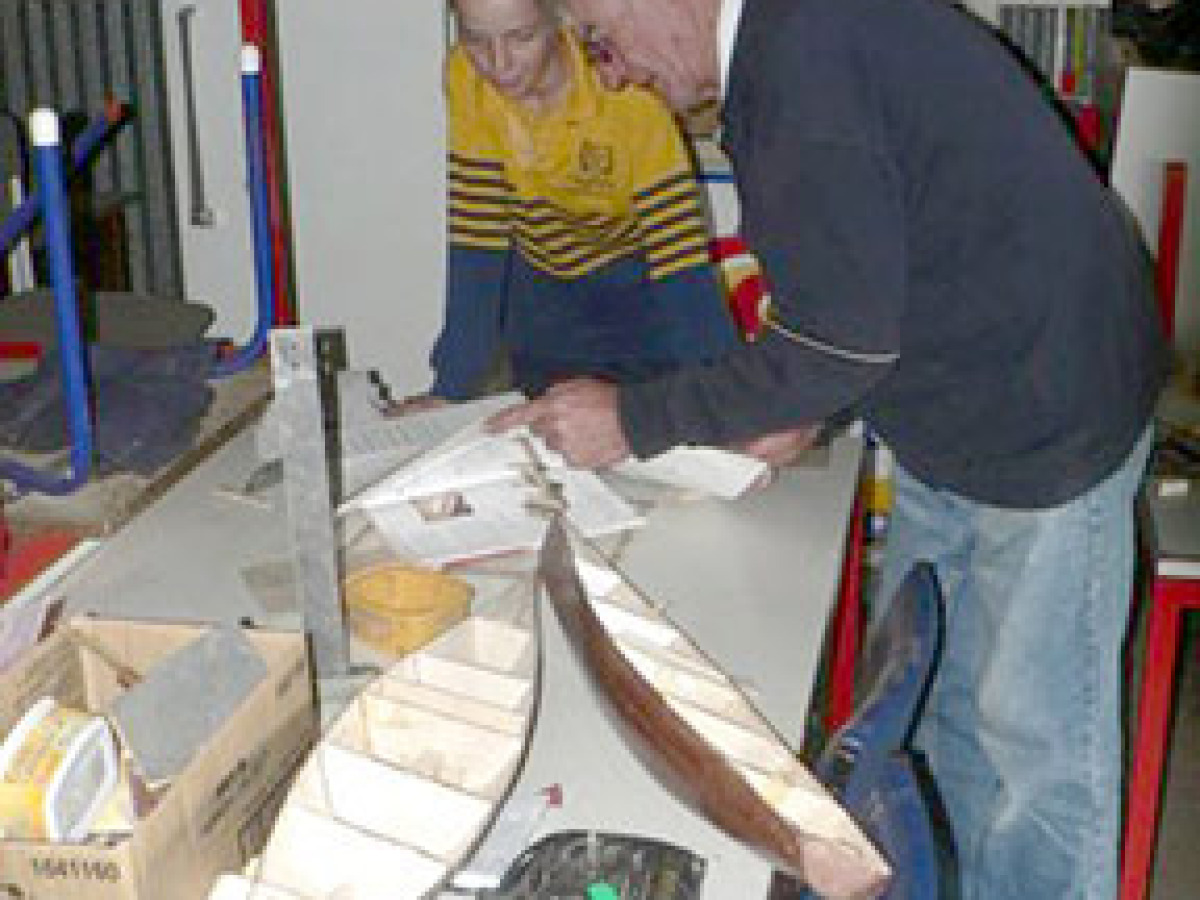 Ray Aisbett from South Australian shown building a model yacht with a 14 yar old boy